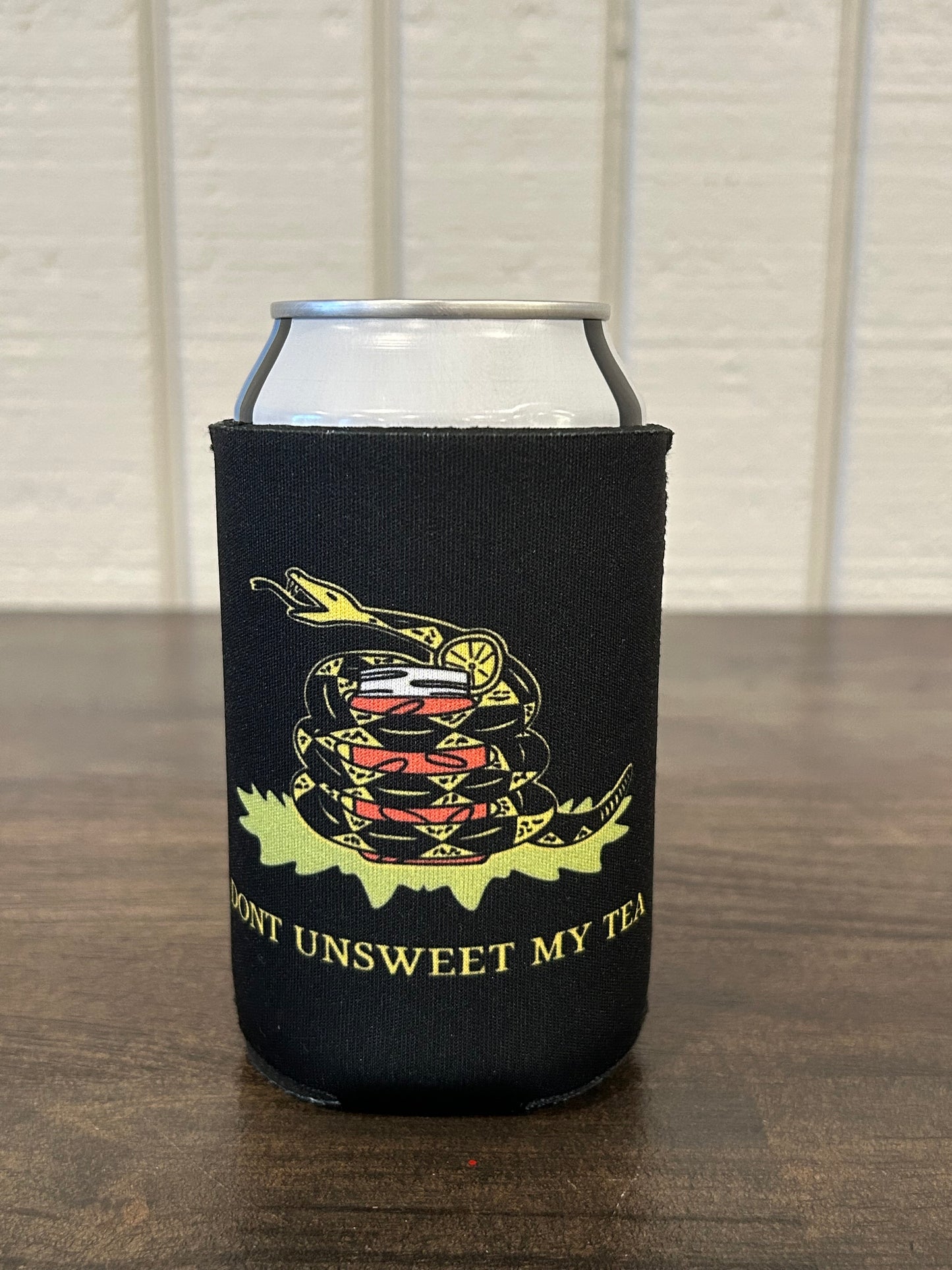 Black can cooler with graphic of yellow snake wrapped around sweet tea with the txt Don't Unsweet My Tea