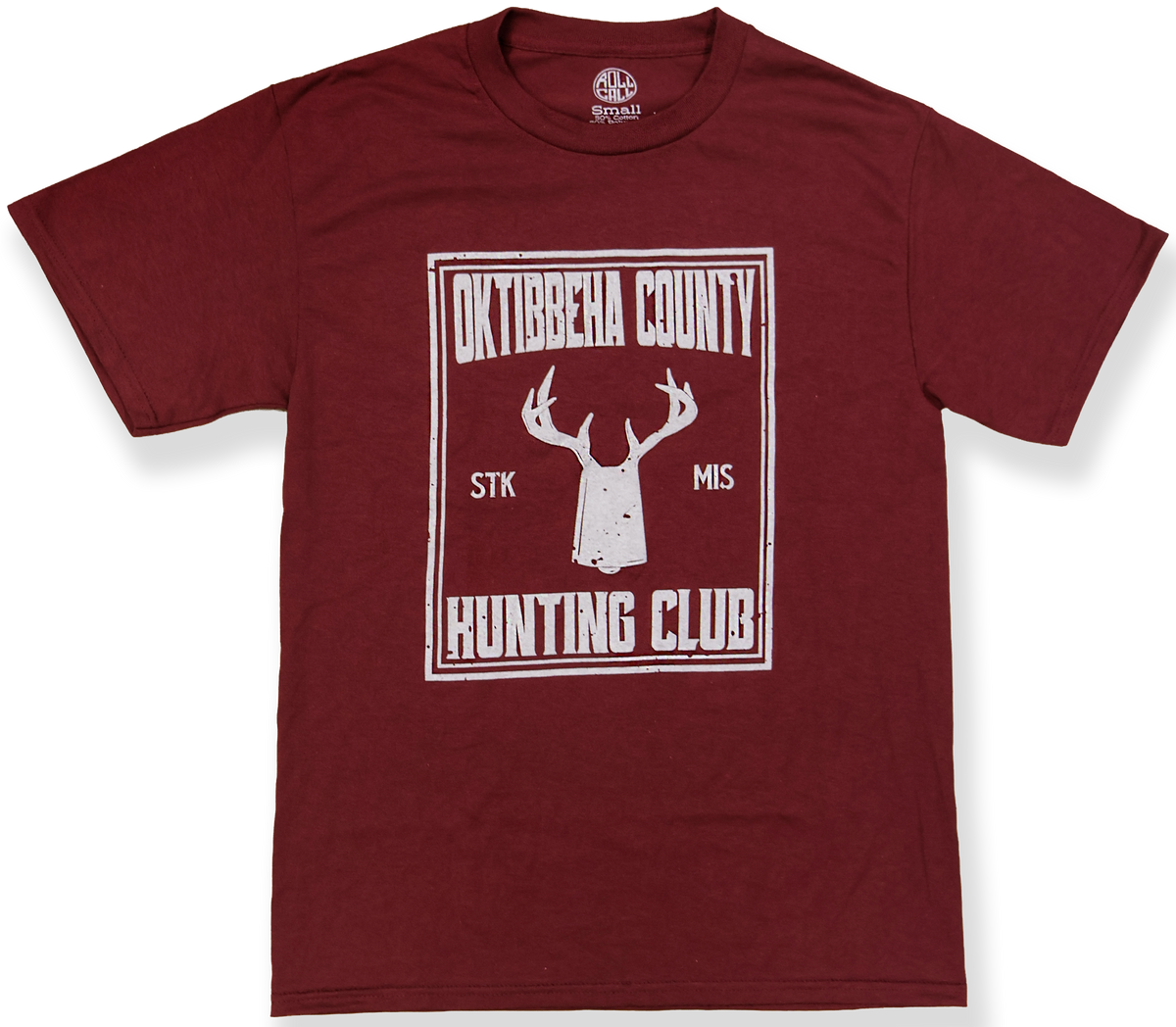 A maroon short-sleeve crewneck t-shirt with a white distressed graphic on the front reading 'Oktibbeha County Stk Mis Hunting Club' around a deer head and cowbell silhouette.
