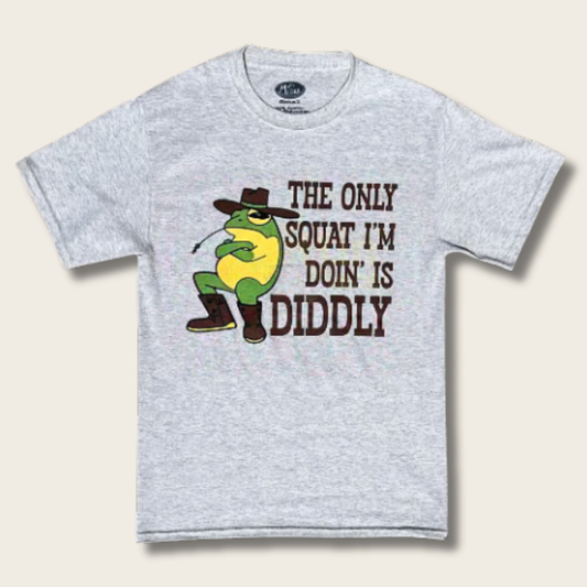A light heather gray short-sleeve t-shirt featuring a graphic of a green frog wearing a brown cowboy hat and boots, next to the text 'THE ONLY SQUAT I'M DOIN' IS DIDDLY' in brown.