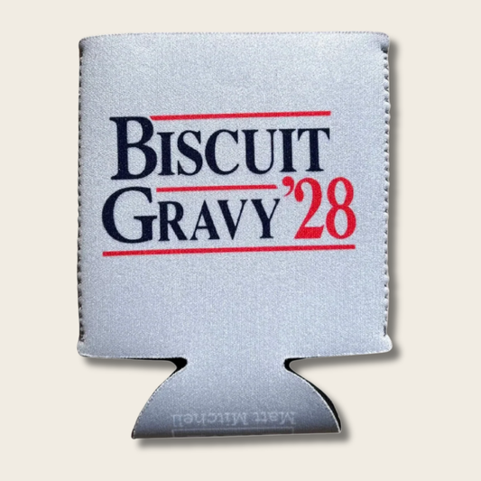 A silver koozie can cooler featuring the text 'BISCUIT GRAVY '28' in navy blue and red, with thin red horizontal lines above and below the text. The product is shown on a light beige background.