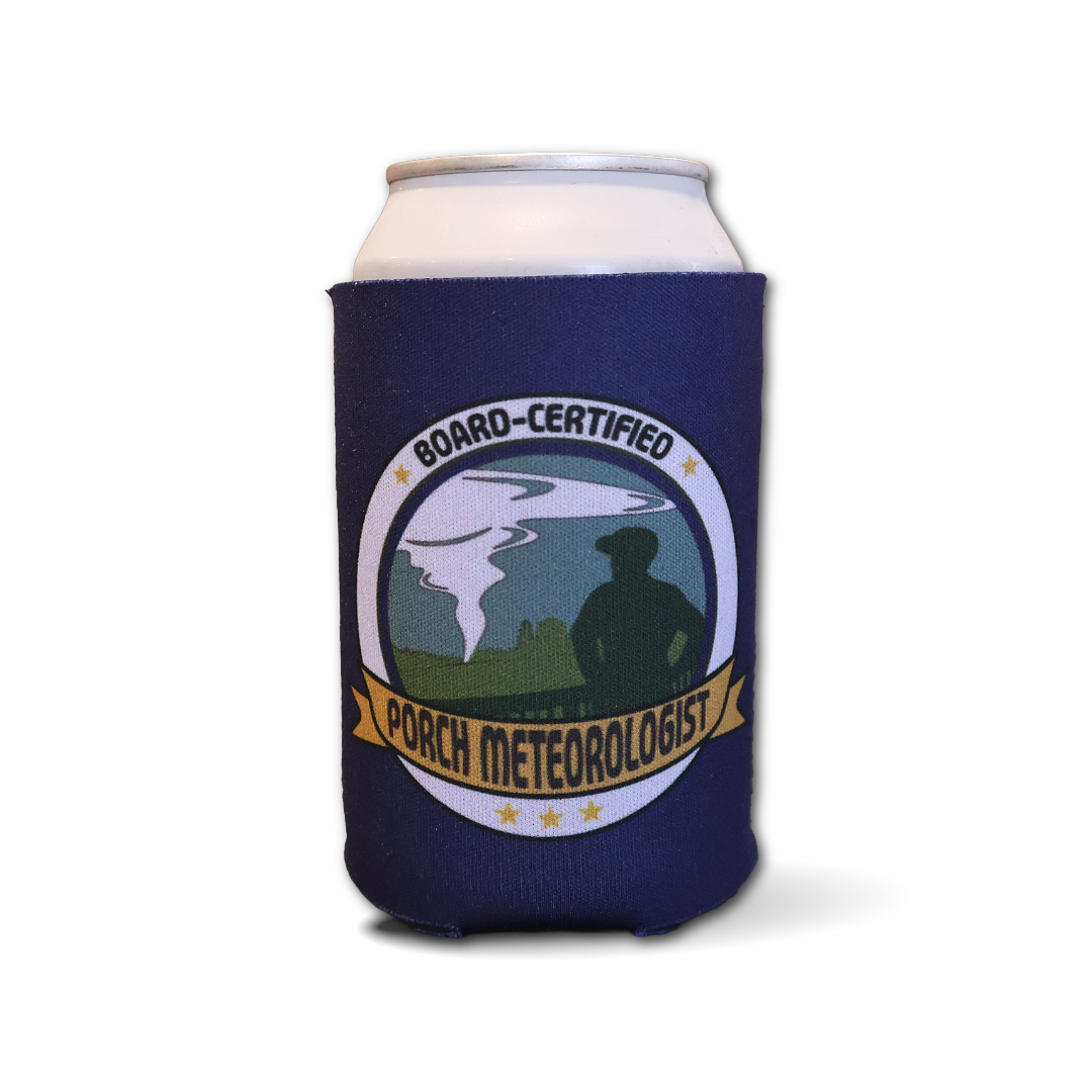 A navy blue can cooler sleeve on a white can, featuring a circular 'Board-Certified Porch Meteorologist' graphic with a tornado illustration and a silhouetted figure.