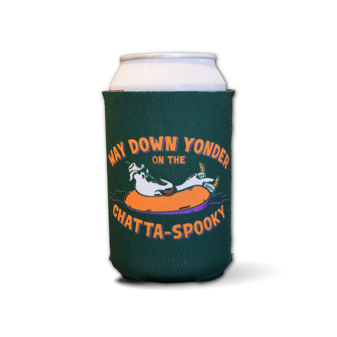 A dark green can cooler sleeve on a silver aluminum can, featuring a cartoon ghost in an orange inner tube with the text 'WAY DOWN YONDER ON THE CHATTA-SPOOKY' on a white background.