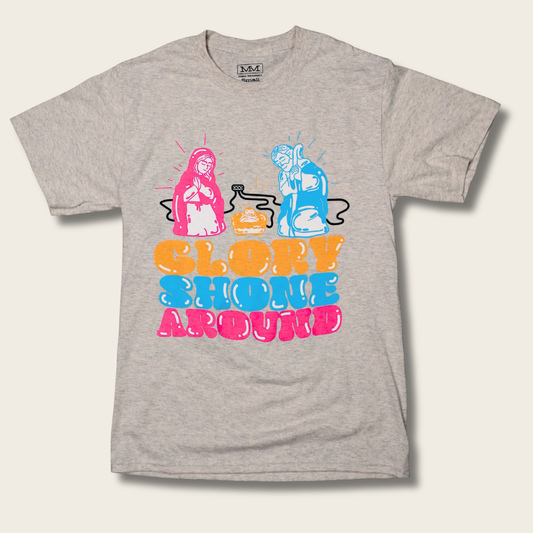 A heather gray short-sleeve t-shirt with a colorful graphic of two figures and the text 'GLORY SHONE AROUND' in pink, orange, and blue bubble letters.