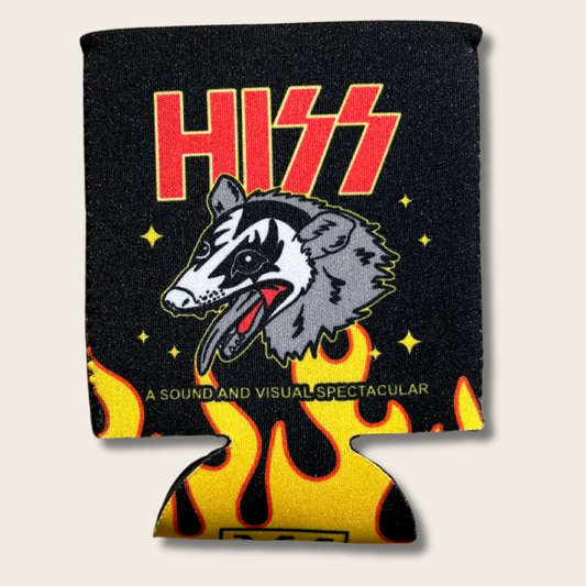 A black can cooler featuring the red and yellow Kiss logo, a gray and white wolf graphic, yellow stars, and yellow and orange flames along the bottom edge, shown against a light beige background.