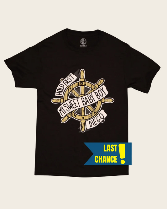 Black t-shirt with a ship's wheel graphic and text on a white background