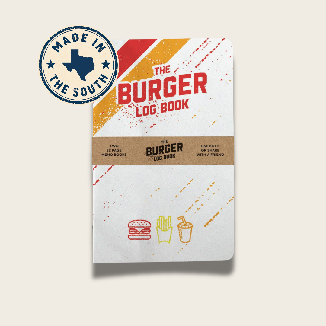 The Burger Log Book shown upright on a light beige background with a circular 'Made in the South' badge in the upper left. The book has a white cover with red and orange graphic stripes, a tan paper band across the middle, and burger, fries, and drink icons near the bottom.