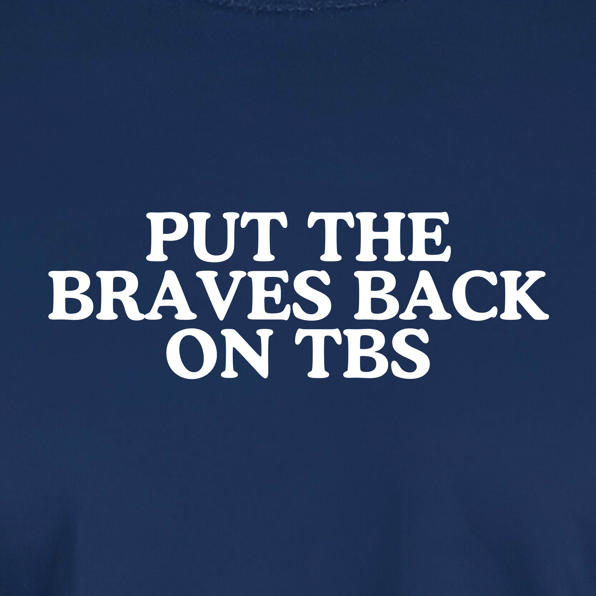 Atlanta baseball shirt design closeup with “Put the Braves Back on TBS” text in white on navy shirt